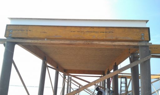 Structurally Insulated Panel Systems on piling foundation by Highpointe DBR, LLC
