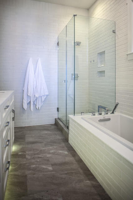 Glass shower enclosure in in Custom SIP Home  by Highpointe DBR, LLC