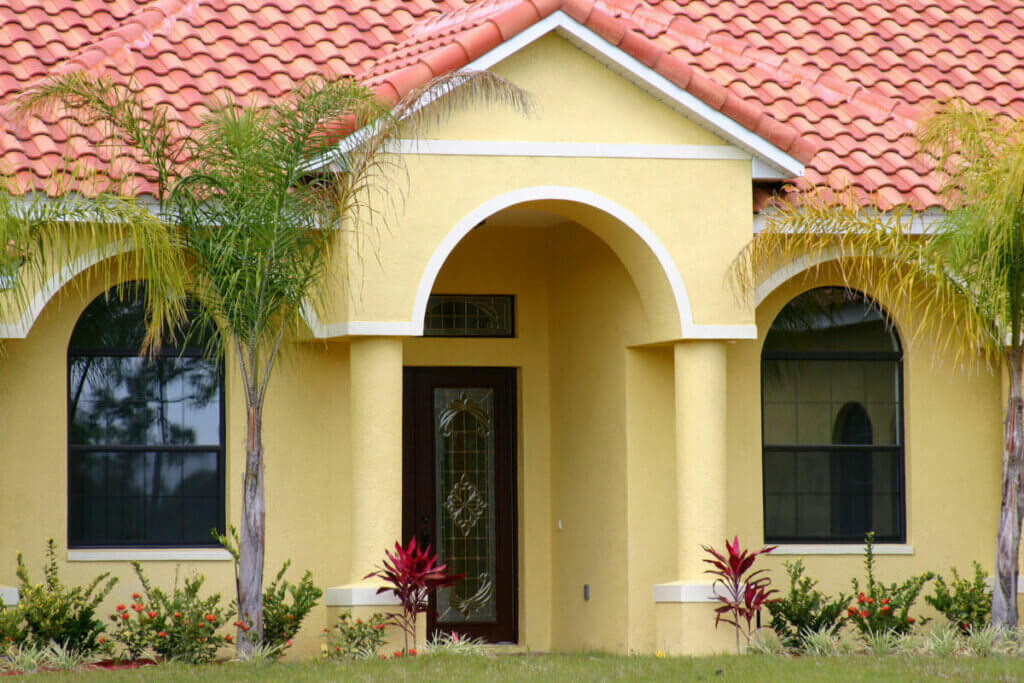 Entryway to a middle class home in central Florida. Red tile roof and yellow walls.